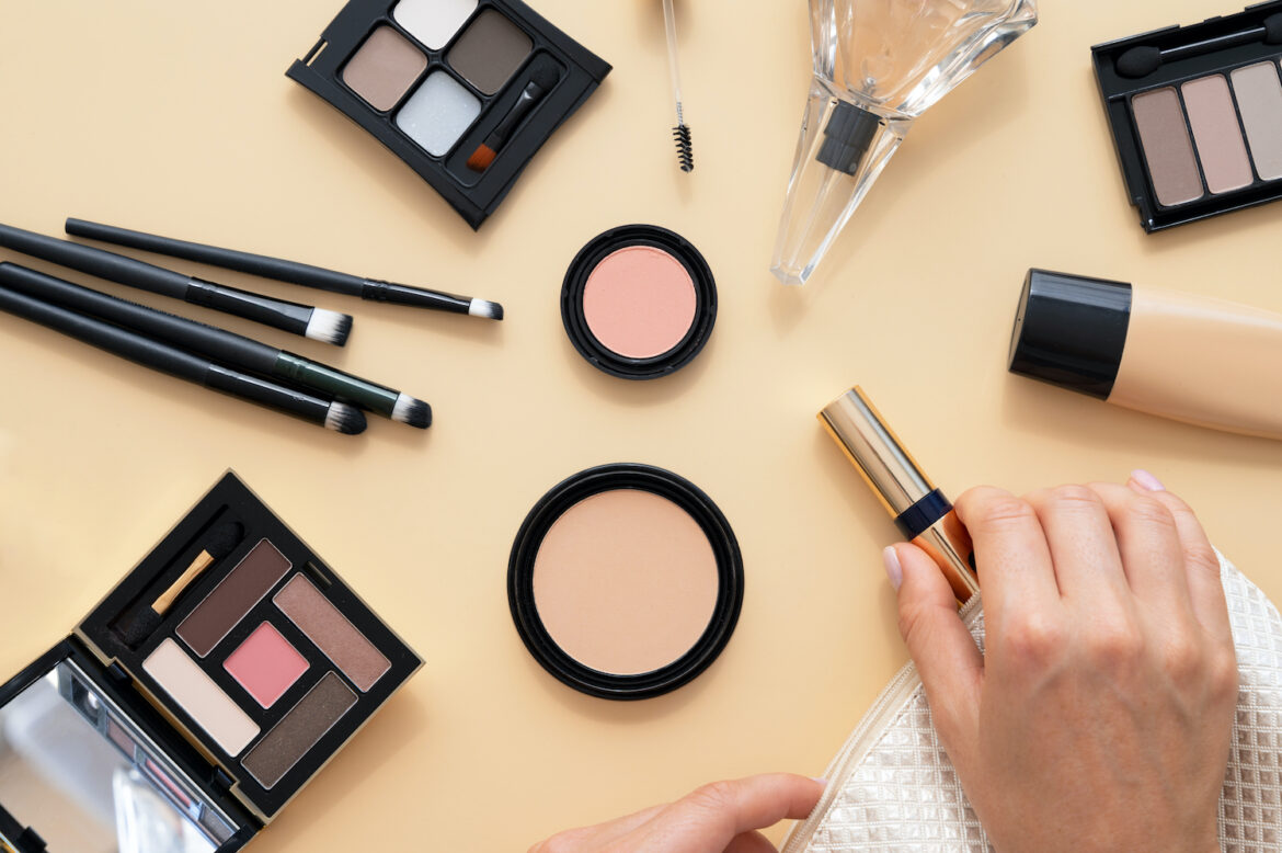 top-view-hand-holding-makeup-product